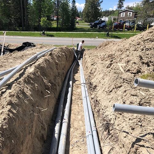 Worker installing drainage pipes in Southern Berkshire County